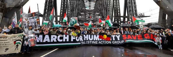 protesters march across the sydney harbour bridge during the